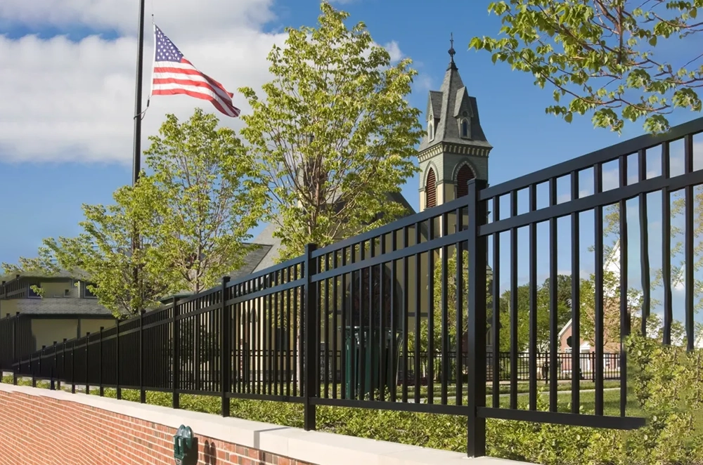 A fence with a church in the background