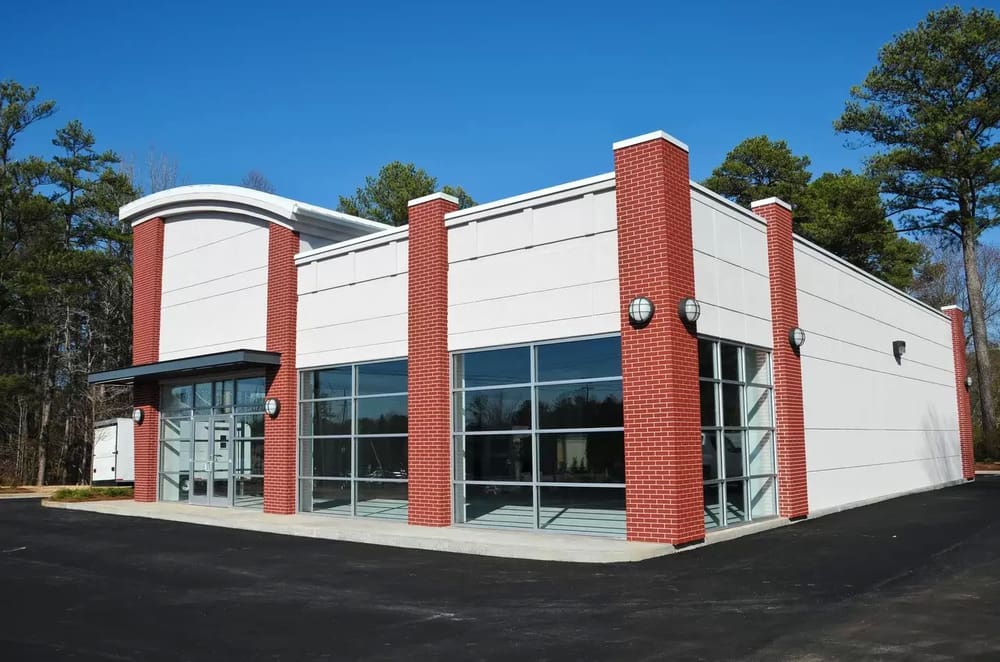 A large building with red and white trim.