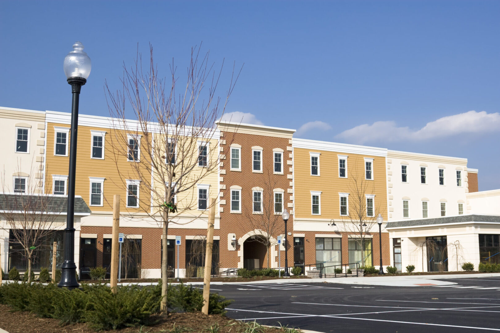 A large building with many windows and trees