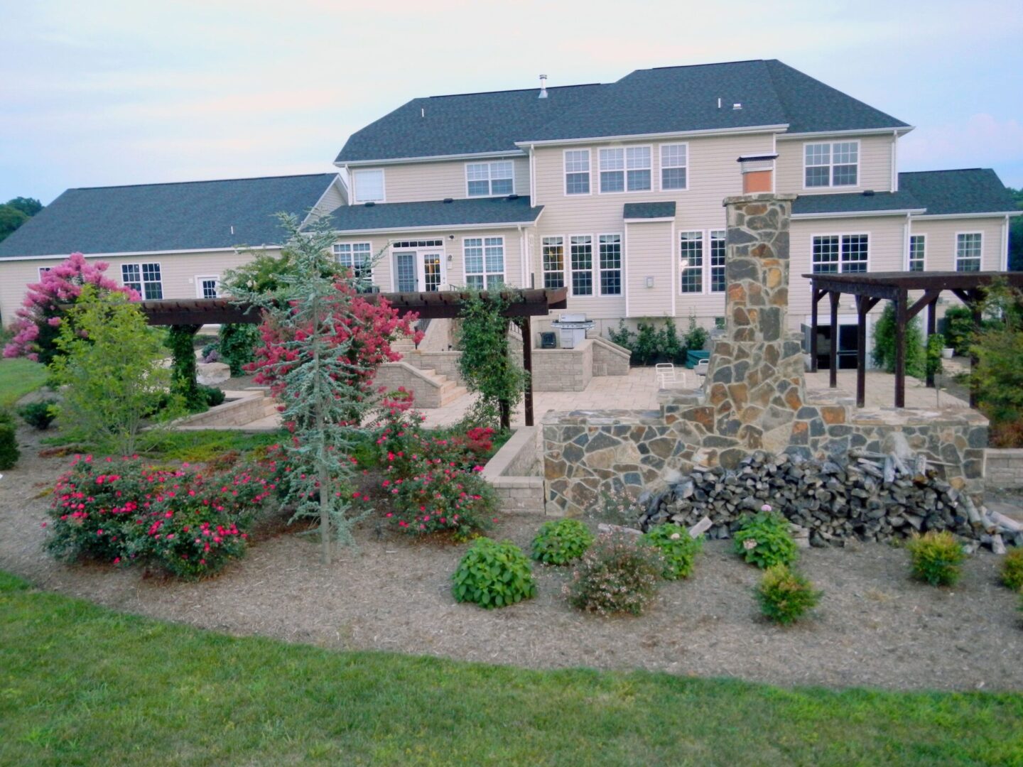 A large yard with many flowers and bushes.