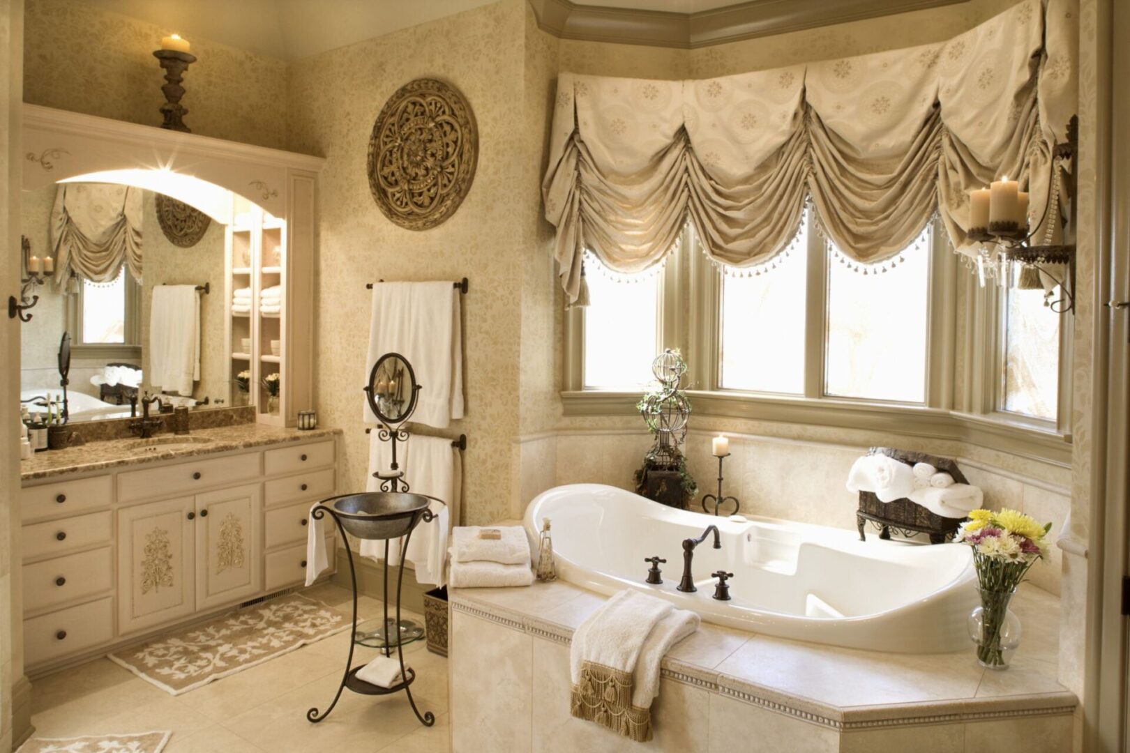 A bathroom with a large tub and sink.