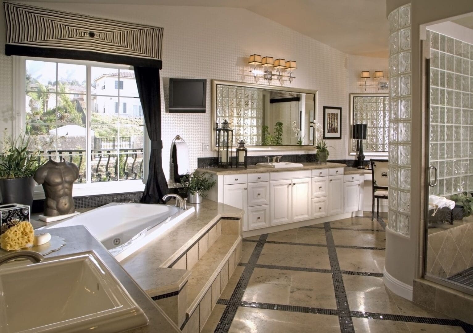 A bathroom with a large mirror and a tub.